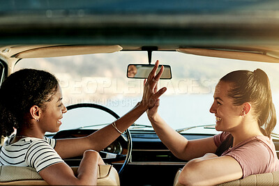 Buy stock photo High five, road trip and friends in car for holiday, travel or vacation on outdoor adventure. Smile, explore or women with celebration, bonding or vehicle for weekend getaway, scenery or journey