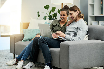 Buy stock photo Online, couple and watching movies on laptop, home and bonding with entertainment, happy and lounge. Relax, woman and smile with man in living room, subscription and tech with film for date in house