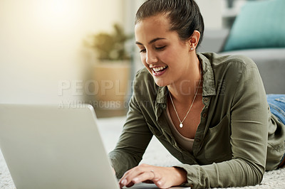 Buy stock photo Laptop, typing and happy woman relax on floor for blog, online search or laugh. Computer, internet and girl on carpet in home for browsing website, social media and reading funny meme with flare
