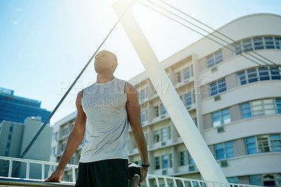 Buy stock photo Black man, thinking and stretching with leg in city for fitness, workout preparation or exercise. Active, male person or getting ready with warm up or contemplation for outdoor training in urban town