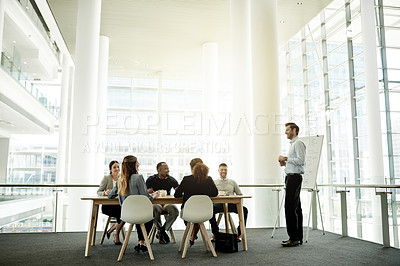 Buy stock photo Business, presentation and man in office, group and planning for investment deal. Finance agency, people or speaker in meeting, discussion or feedback for profit growth, company mission or teamwork