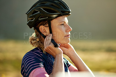 Buy stock photo Cycling, thinking and woman with helmet in nature for exercise, workout and fitness outdoor. Sports, cyclist safety and person with gear for adventure, travel and training for biking competition