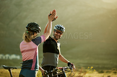 Buy stock photo High five, fitness and bicycle with couple in nature for triathlon training, sports athlete or team. Cardio goals, cycling partner and achievement with man and woman outdoor for hand gesture or space