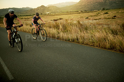 Buy stock photo Couple, cycling or road with bike for fitness, exercise or outdoor workout together in nature. Active man, woman or cyclist with bicycle on street or space for race or sport marathon in countryside