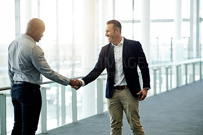 Buy stock photo Happy, meeting and business men with handshake in office for onboarding, collaboration and networking. Corporate, hiring and workers shaking hands for agreement, b2b partnership and welcome in lobby
