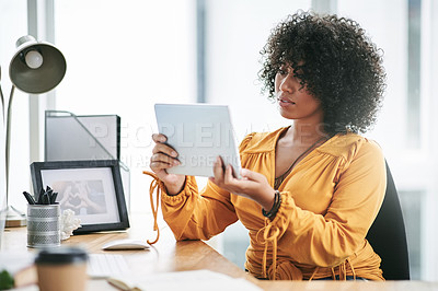 Buy stock photo Agency, business and tablet with editor woman at desk in office for online fashion magazine. App, internet and publication with person in workplace to post or review article for virtual column