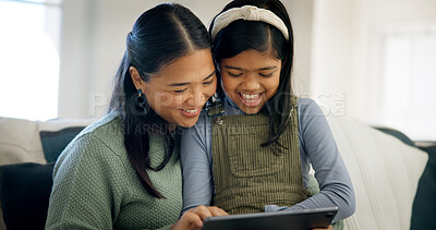 Buy stock photo Mother, child and smile with tablet in home for fun drawing app, bonding activity and development. Asian family, mom and girl kid with tech on sofa for online art puzzle, digital gaming or connection