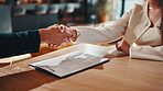 Woman, handshake and realtor at house with clipboard, closing deal and agreement for real estate. People, shaking hands or consultant in home with contract, negotiation and lease of property purchase