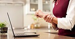 Laptop, hands and remote work in home with wrist pain, nerve strain or carpal tunnel syndrome. Freelancer, tech and woman with sore joint from WFH sprain, poor ergonomics and massage for inflammation