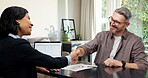 Man, contract and handshake with lawyer in office for business agreement, deal or legal settlement. Male person, attorney or woman shaking hands with client for financial proposal, loan or investment
