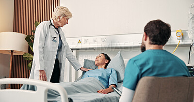 Buy stock photo Doctor, nurse and talk in hospital with patient, wellness update and support for medical treatment. Healthcare worker, mature woman and discussion in clinic for disease recovery, advice and assurance