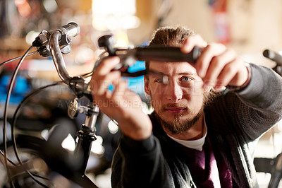 Buy stock photo Repair, inspection and man with handle, bike store and maintenance with small business. Worker, person and employee with bicycle, fixing and check brakes with skills, service and eco friendly