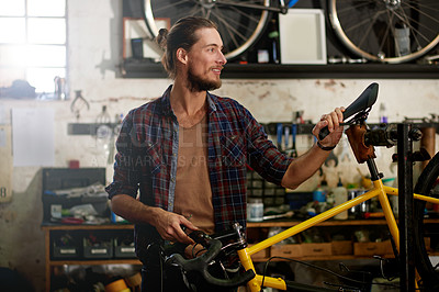 Buy stock photo Man, bike repair and happy at workshop with saddle inspection, maintenance and services at garage. Person, bicycle mechanic and safety check with seat, smile or solution for comfort at small business