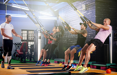 Buy stock photo Coach, people and suspension trainer in class for body, wellness and bodybuilding exercise. Instructor, active and athletes in training group with cable equipment for muscle power, workout or fitness