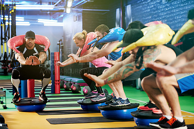 Buy stock photo Personal trainer, squat and people with sand bag exercise for training, legs workout or core strength. Teaching balance, coach and athlete with half ball for fitness class, body health or gym support
