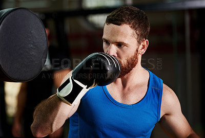 Buy stock photo Boxing, man and training with pad at gym for fight workout, sparring or practice technique. Athlete, fitness or professional boxer in health club for punch conditioning, sports performance or stamina