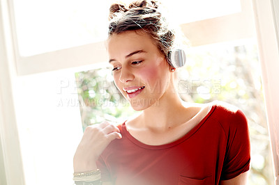 Buy stock photo Girl, happy and headphones with music in home for audio playlist, podcast and sound album with flare. Relax, teenager and listening to streaming subscription for radio song, track and weekend break