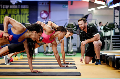 Buy stock photo Fitness, dumbbell and women with personal trainer in gym for training, muscle strength and health. Sports center, coach and people with weights for wellness, workout and challenge in exercise class
