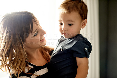 Buy stock photo Happy, bonding and mother with toddler in home with love, care and connection together on weekend. Smile, family and mom holding boy kid for growth and childhood development in living room at house.