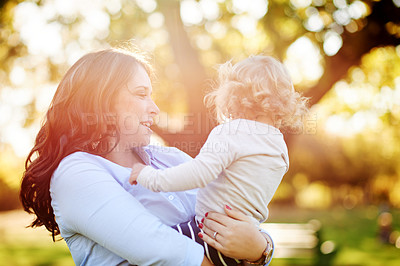 Buy stock photo Love, mother and carry child at park for safety, security or bonding with kid on vacation. Nature, mom and hug toddler with embrace for connection, bokeh and care on family holiday with happy parent