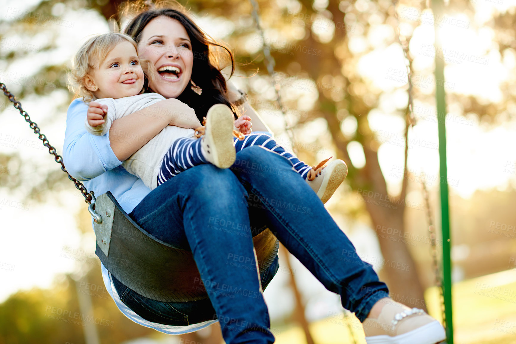 Buy stock photo Mom, laugh and swing with child, playground or affection for toddler in nature or playing with girl. Outdoor, woman and fun with daughter on weekend, happy or childcare on holiday, family and park