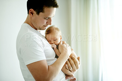 Buy stock photo Sleeping, baby and bonding with dad, home and first time parent with love for newborn and childcare. Family, together and man with child in nursery, comfort and father with affection, rest or safety