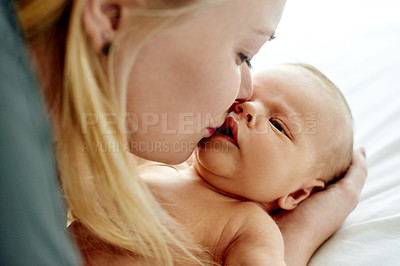 Buy stock photo Relax, kiss and mother with baby on bed for bonding, care and family time in home together. Happy, security and newborn child with mom in bedroom for support, safety and protection in apartment.