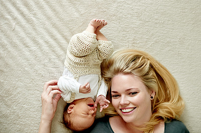 Buy stock photo Happy, mom and rest with baby, home or comfortable on floor, bonding and single parent with newborn. Sleeping, infant and woman with smile in house, family and relax with daughter on ground and break