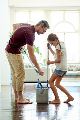 Buy stock photo Father, kid and mop in home for cleaning, learning hygiene or wash floor for maintenance. Dad, girl and bucket for chores with parent for help, teaching housekeeping or housework with family together
