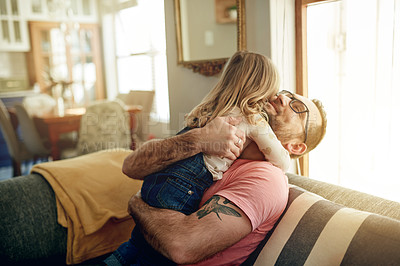 Buy stock photo Father, child and hug in home for love, support and connection with girl. Sofa, dad and embrace kid for care, safety or happy parent bonding with daughter for trust with family together in lounge