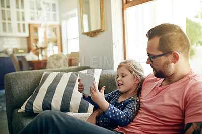 Buy stock photo Relax, dad and child with tablet, lounge and watching movie with subscription on website and bonding. Family, man and streaming cartoons with daughter, online and entertainment with tech in house