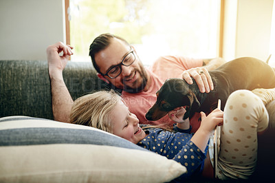 Buy stock photo Tablet, dog and father with daughter on sofa for bonding, support and animal care. Happiness, loyalty and pet owner with man and child with puppy in family house for trust, digital search and love