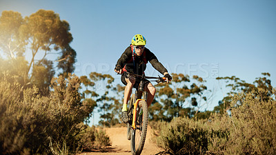 Buy stock photo Bike, off road and speed with man in mountains for outdoor adrenaline, adventure or training. Exercise, fitness and ramp with sports person cycling in nature for challenge, competition or performance