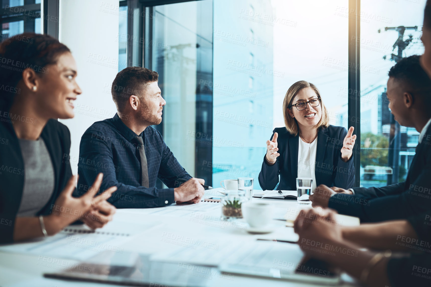 Buy stock photo Business, woman and meeting with group in boardroom, smile and proposal briefing with attention. Collaboration, team leader and explain with listening, strategy and discussion for project in office