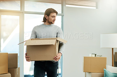 Buy stock photo New home, carry and man with box for moving to house, property mortgage and real estate purchase. Homeowner, investment and person with package for relocation, rental apartment and packing in lounge