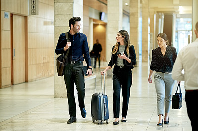 Buy stock photo Walking, discussion and luggage with business people in hotel for conference, booking accommodation and seminar. Convention arrival, suitcase and reservation with employees for hospitality and trip
