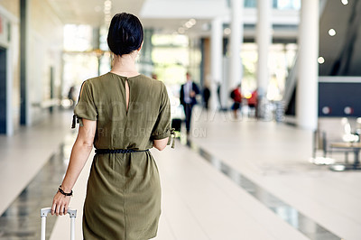 Buy stock photo Woman, back and walking with suitcase for travel, job opportunity or career in corporate building. Female person, commute or traveler with luggage for business trip, journey or destination in lobby