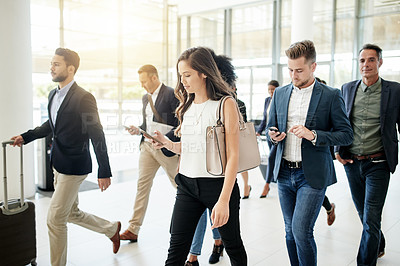 Buy stock photo Business people, walking and travel with agency in corporate building for company immigration. Group, staff or employees moving together with luggage for new career, job opportunity or relocation