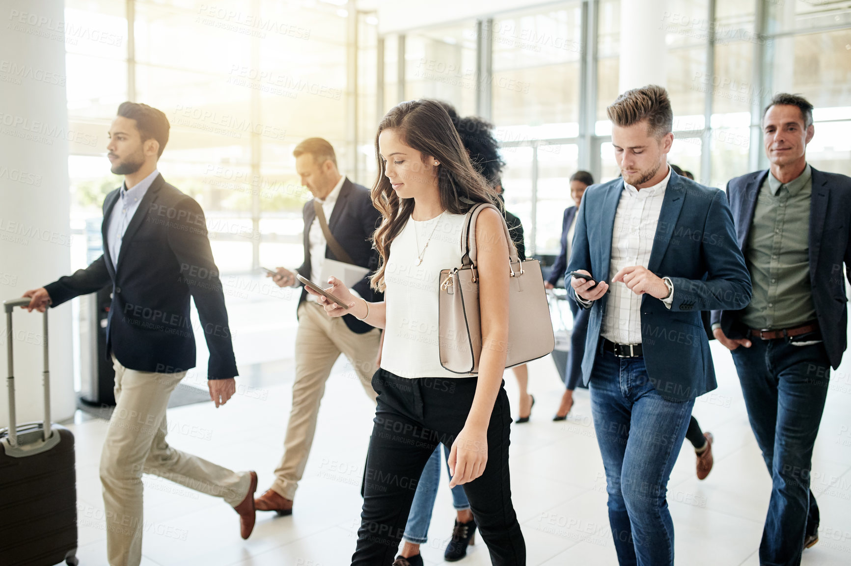 Buy stock photo Business people, walking and travel with agency in corporate building for company immigration. Group, staff or employees moving together with luggage for new career, job opportunity or relocation