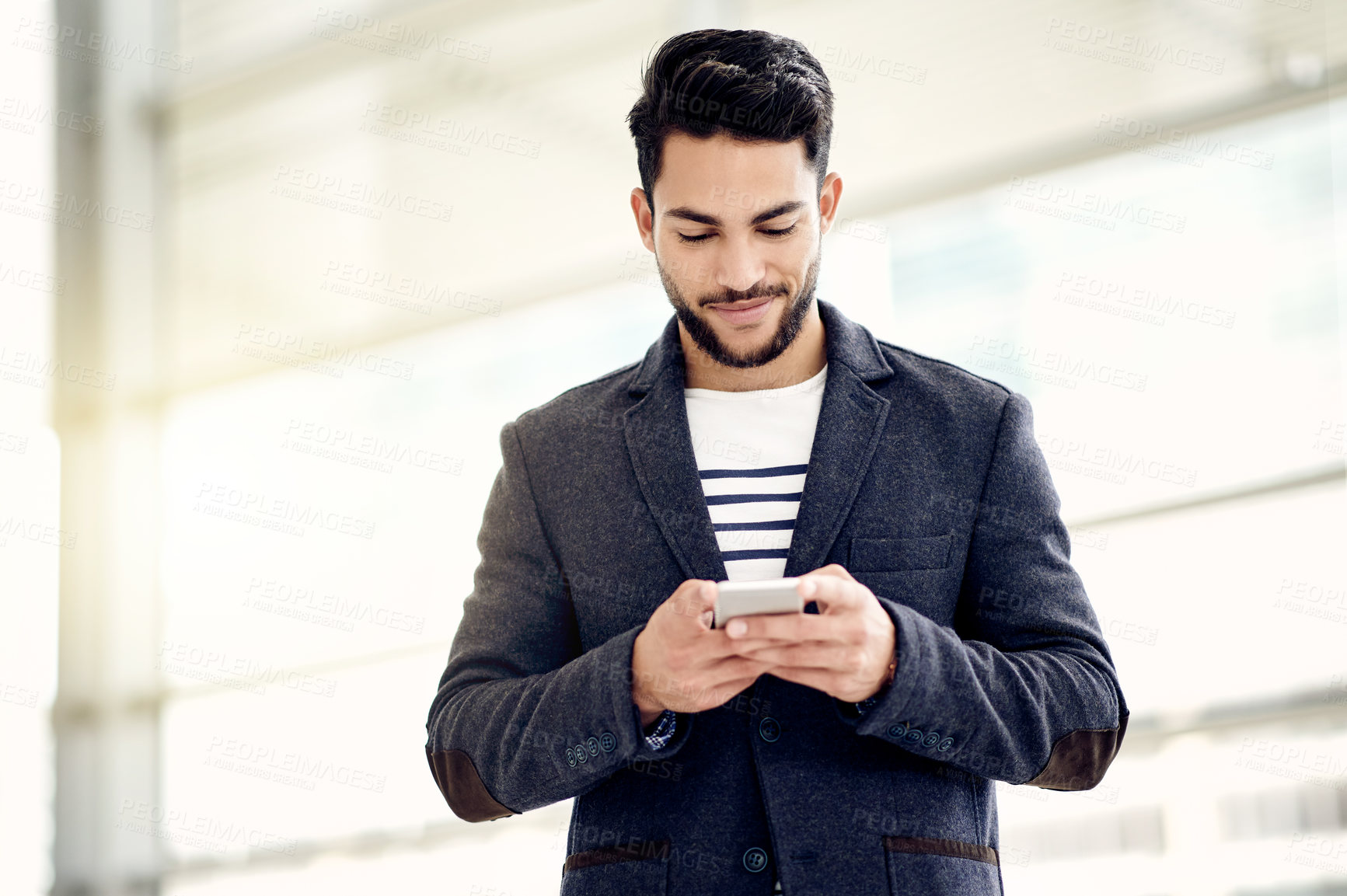 Buy stock photo Smile, texting and businessman in office with smartphone for social media, message and website. Happy, company and entrepreneur with mobile app in workplace for online notification and technology