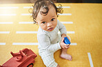Face, nursery and baby play with toys for growth, education and child development at home. Family, childcare and happy kid relax with toy truck, building blocks and having fun learning in bedroom