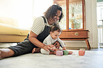 Mother, baby and play with toy blocks in home, learning and education in house. Development, care and happy mama playing with child, number toys and newborn while bonding and having fun together.