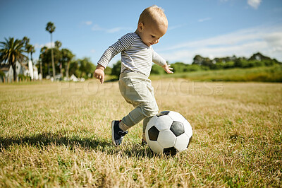 Buy stock photo Soccer ball, sports and baby in field for playing, fun and adventure for fitness, exercise and learning. Childhood, football and happy boy outdoors for games on holiday, summer vacation and weekend
