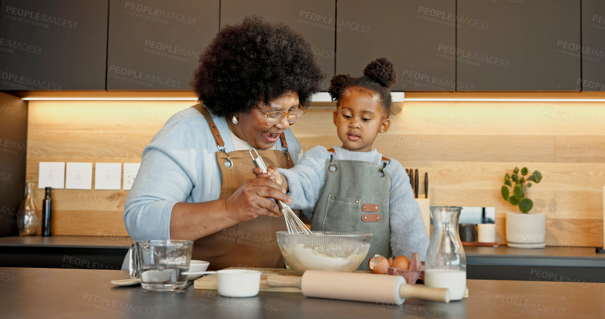 Buy stock photo Grandmother, child and baking with whisk in home, learning and surprise with black family in kitchen. Girl, happy grandma and mix ingredients in bowl to help with guidance, shock or wow for well done