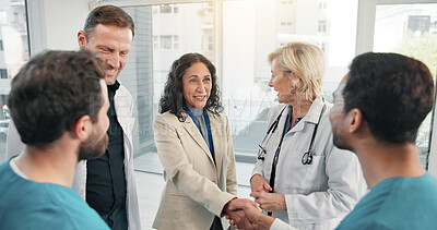 Buy stock photo Doctor, team and handshake with nurse for medical agreement, greeting or welcome new member. People, smile and shaking hands in hospital for partnership, healthcare collaboration and introduction