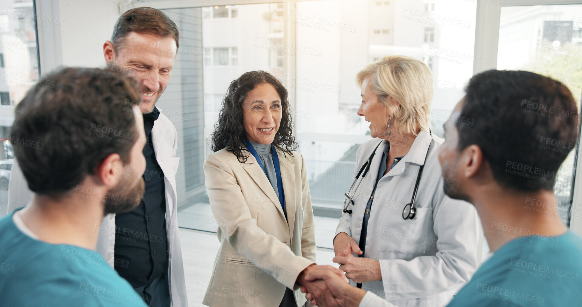 Buy stock photo Doctor, team and handshake with nurse for medical agreement, greeting or welcome new member. People, smile and shaking hands in hospital for partnership, healthcare collaboration and introduction