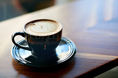 Buy stock photo Cup, coffee and espresso on table at cafe for morning start, caffeine beverage and customer order. Drink, latte and foam cream with design for aesthetic, creative presentation and art for hospitality