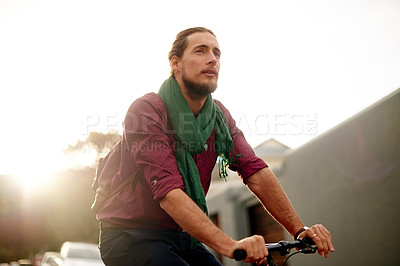 Buy stock photo Travel, commuting and man on bicycle in town for adventure, journey or carbon footprint on holiday. Street, cycling and person on bike for eco friendly transport on vacation in urban city by sunset.