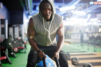 Buy stock photo Black man, training and battle rope at gym for muscle, development and power with workout for growth. Person, exercise and fitness with strong arms, intense and endurance for progress at health club