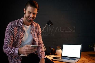 Buy stock photo Business, night and man in office, smartphone and smile with mockup space, laptop or social media. Person, entrepreneur or freelancer in workplace, cellphone or communication with deadline or tech